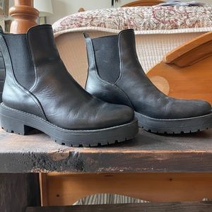 Justina by Sam Edelman pulling chunky boots.